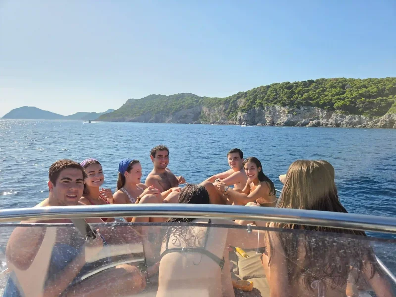 Group of young friends enjoying a private boat tour near the Elaphiti Islands in Dubrovnik with Garitransfer
